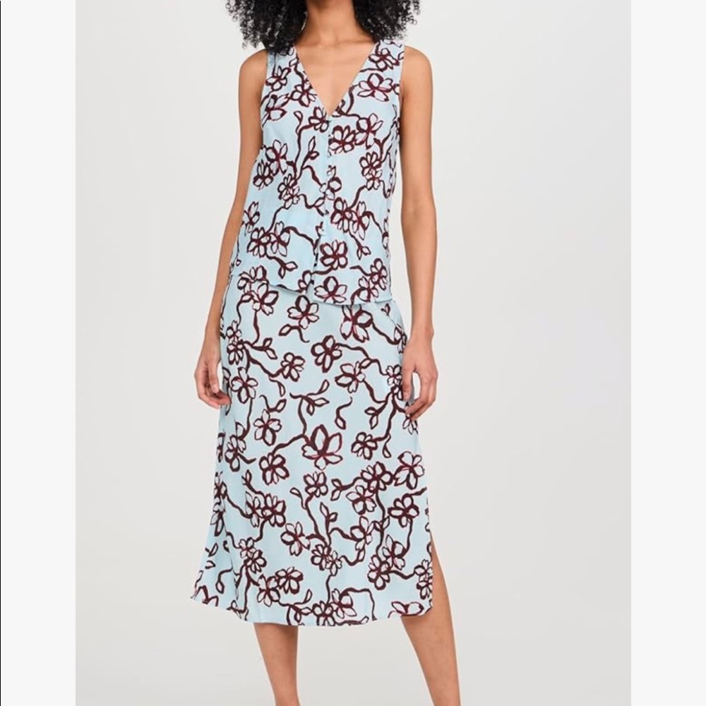 The cutaway vest top in floral is available. NWT!